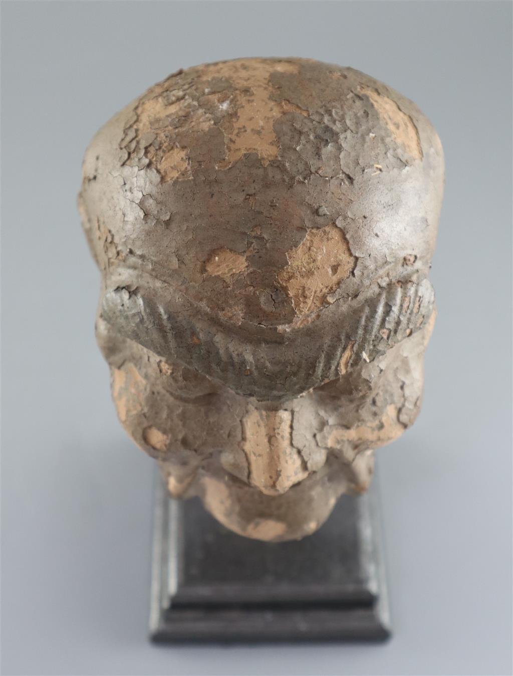 A Chinese clay and wood head of a luohan, possibly Song dynasty, 29cm high